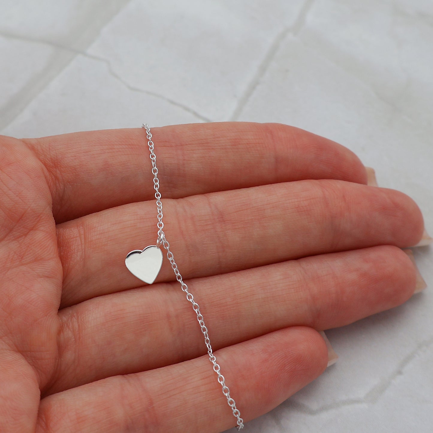 Pulsera con colgante de corazón macizo móvil