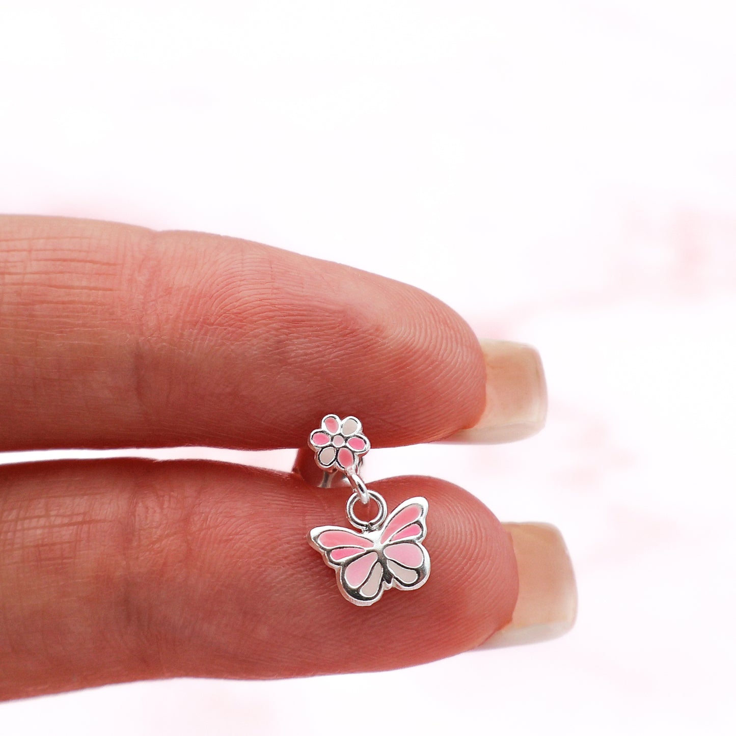 Stud earrings with butterflies and flowers in shades of pink