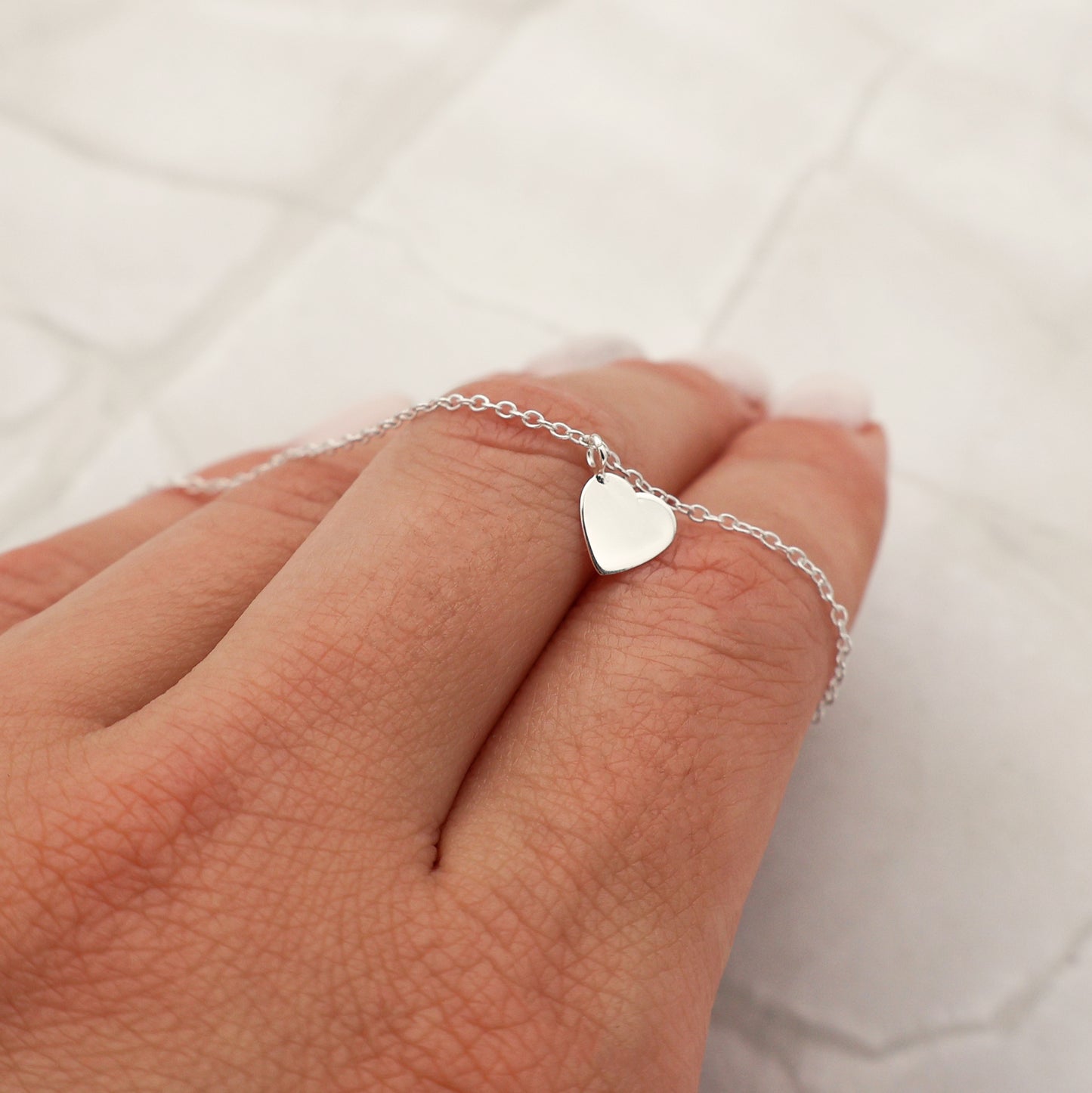 Pulsera con colgante de corazón macizo móvil