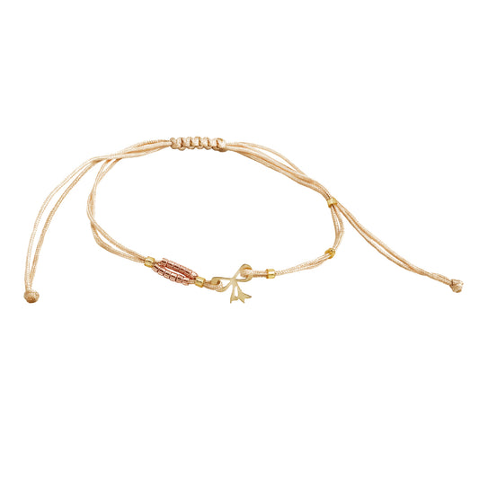 Bracelet with a 14K solid gold bow pendant and Miyuki beads