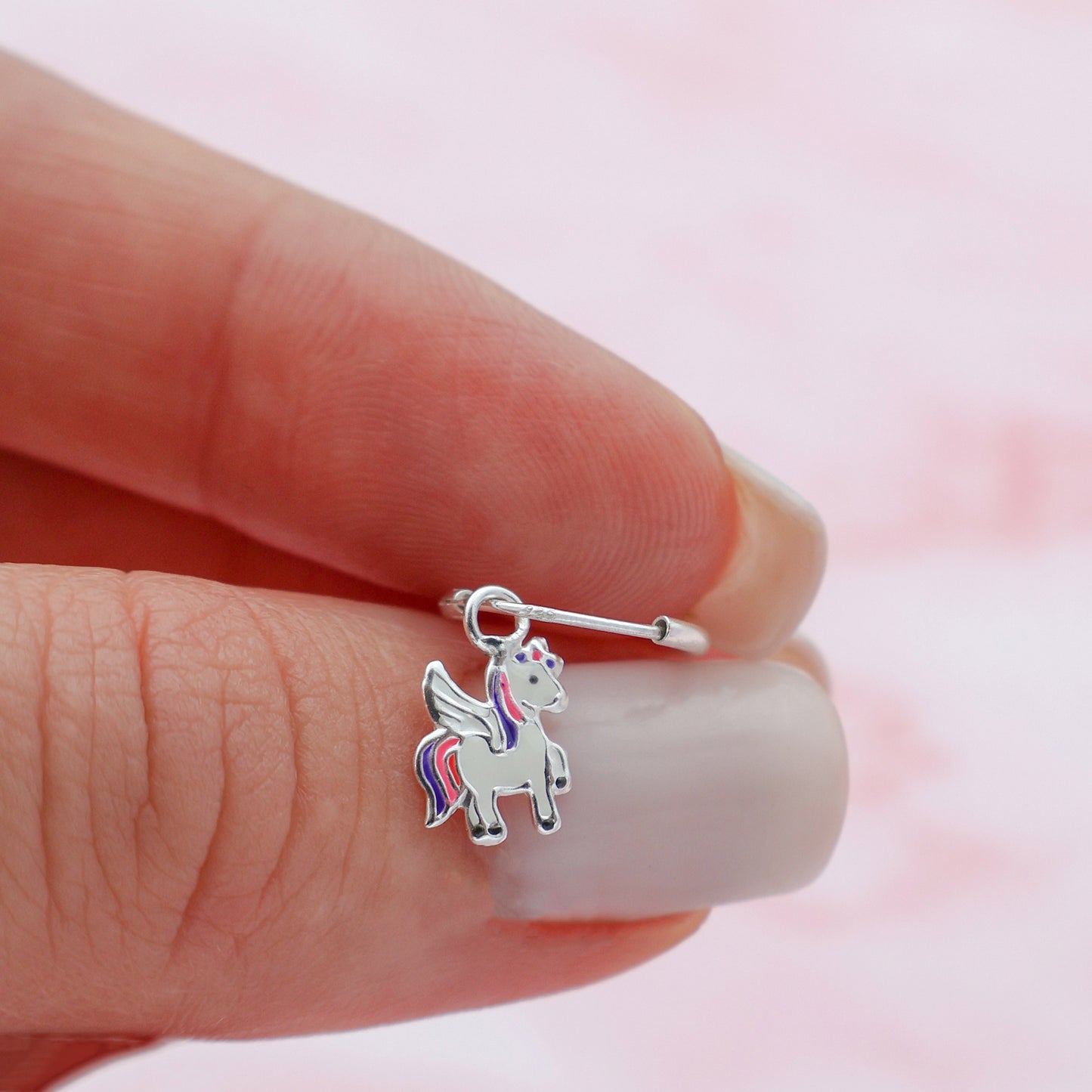 Round drop earrings with a pink and purple unicorn