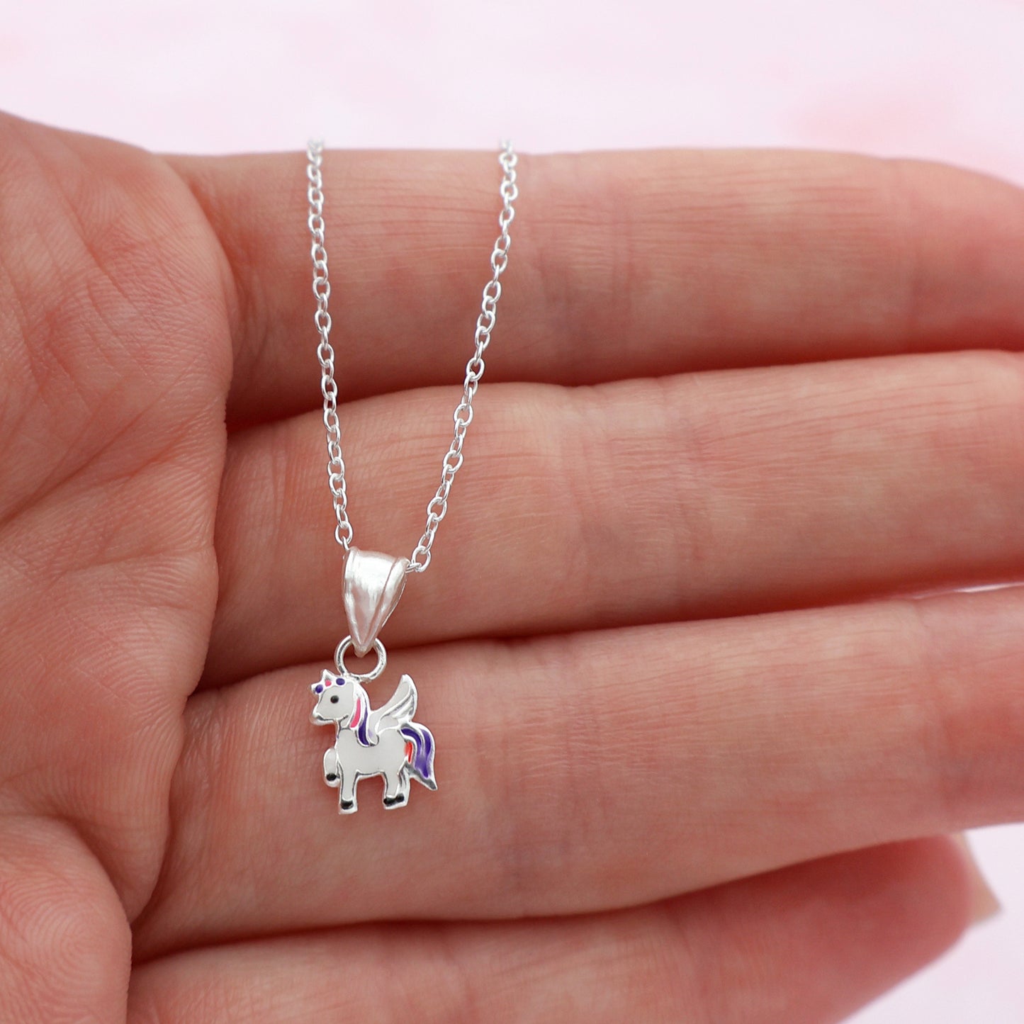 Necklace with a pink and purple unicorn pendant