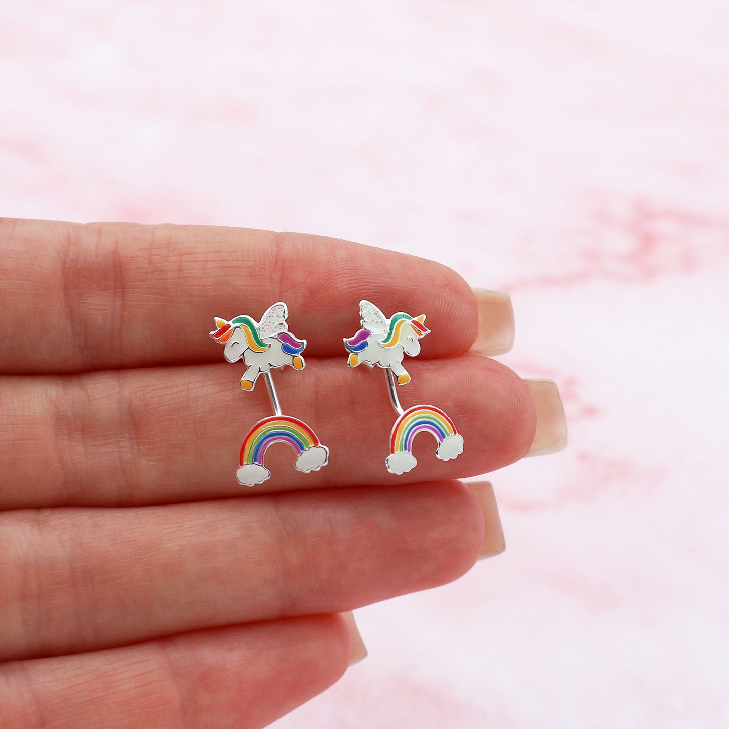 Stud earrings with a unicorn and a rainbow