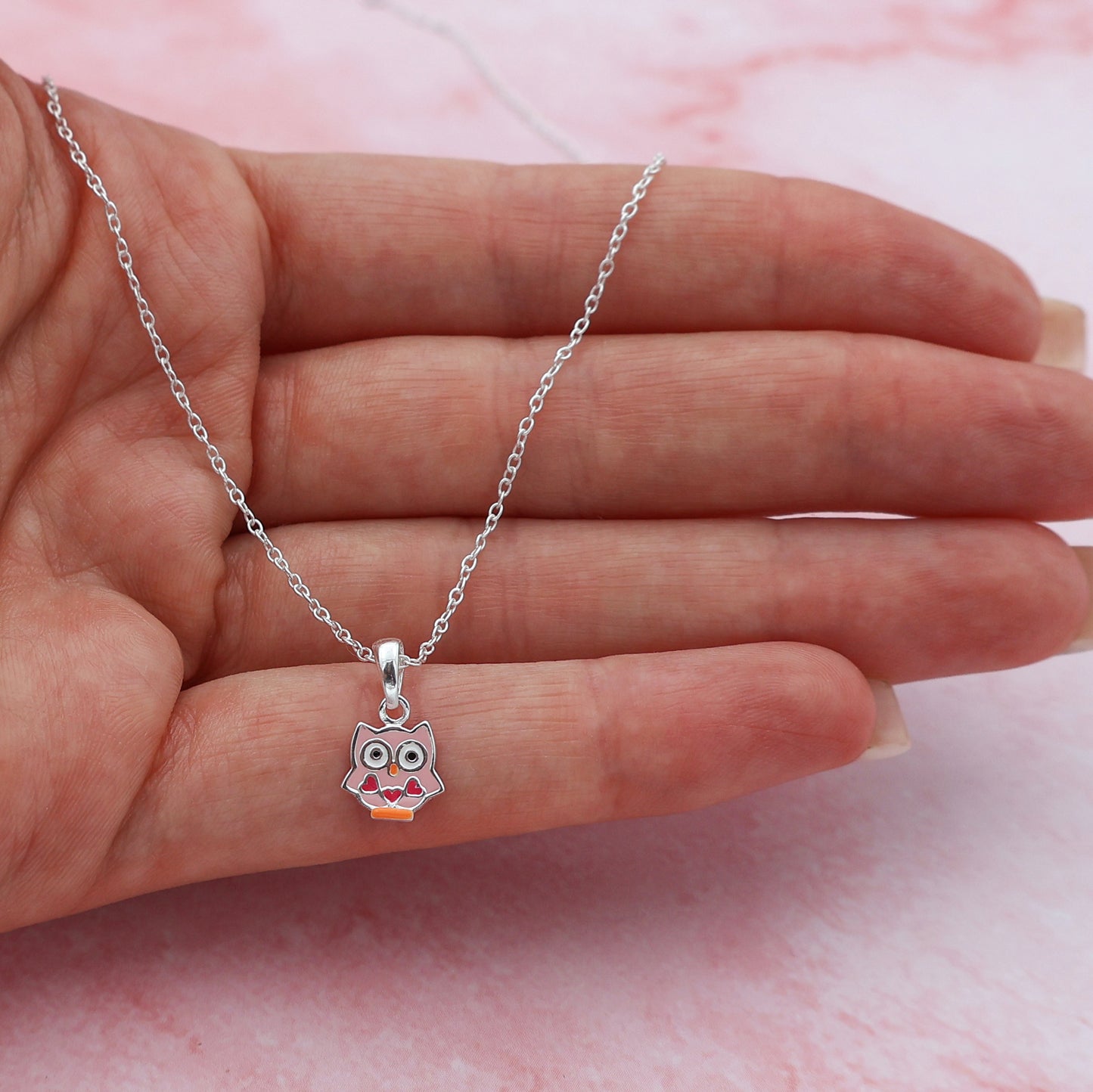 Necklace with a pink owl and 3 hearts