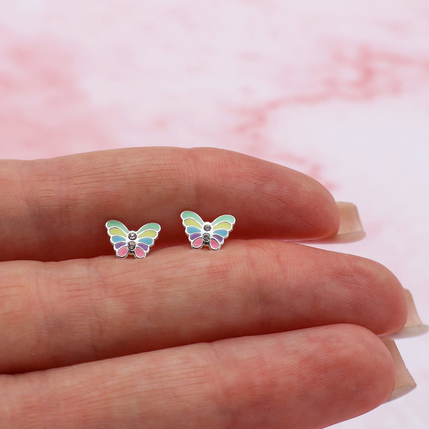 Stud earrings, butterfly-shaped, with multicolored wings and white crystals