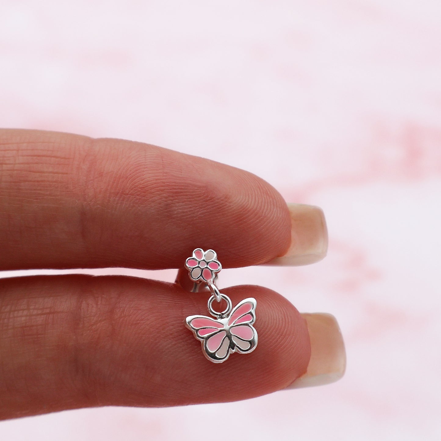 Stud earrings with butterflies and flowers in shades of pink