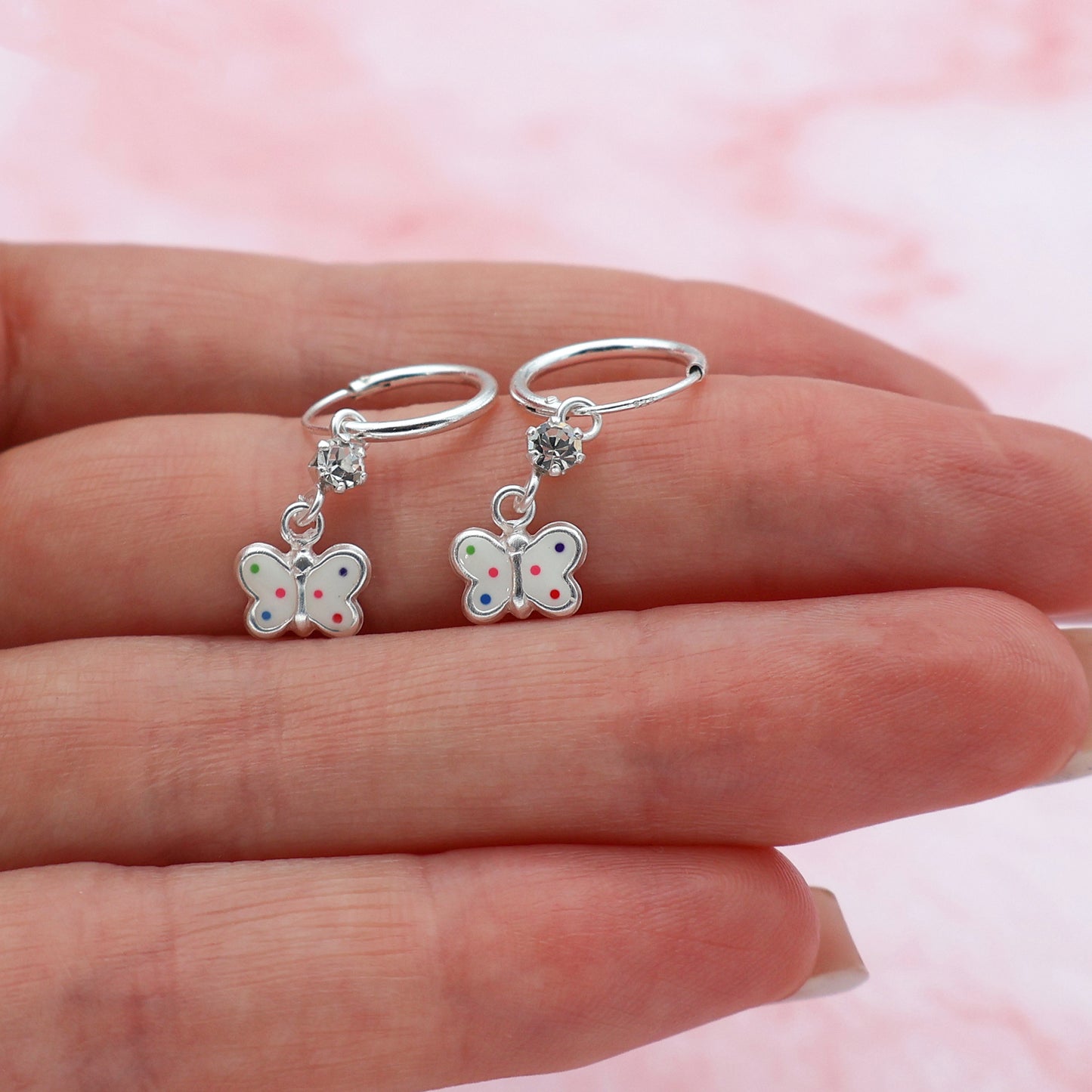 Round drop earrings with butterflies and white crystals