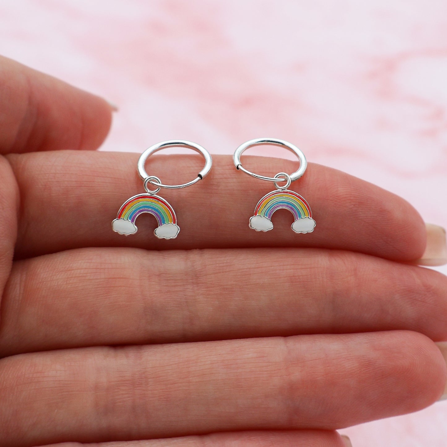 Round hook earrings with clouds and a rainbow