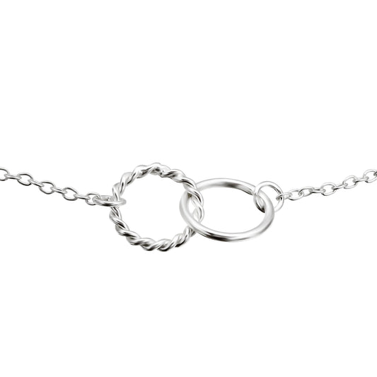 Bracelet with interlocking circle pendants, one simple and one braided