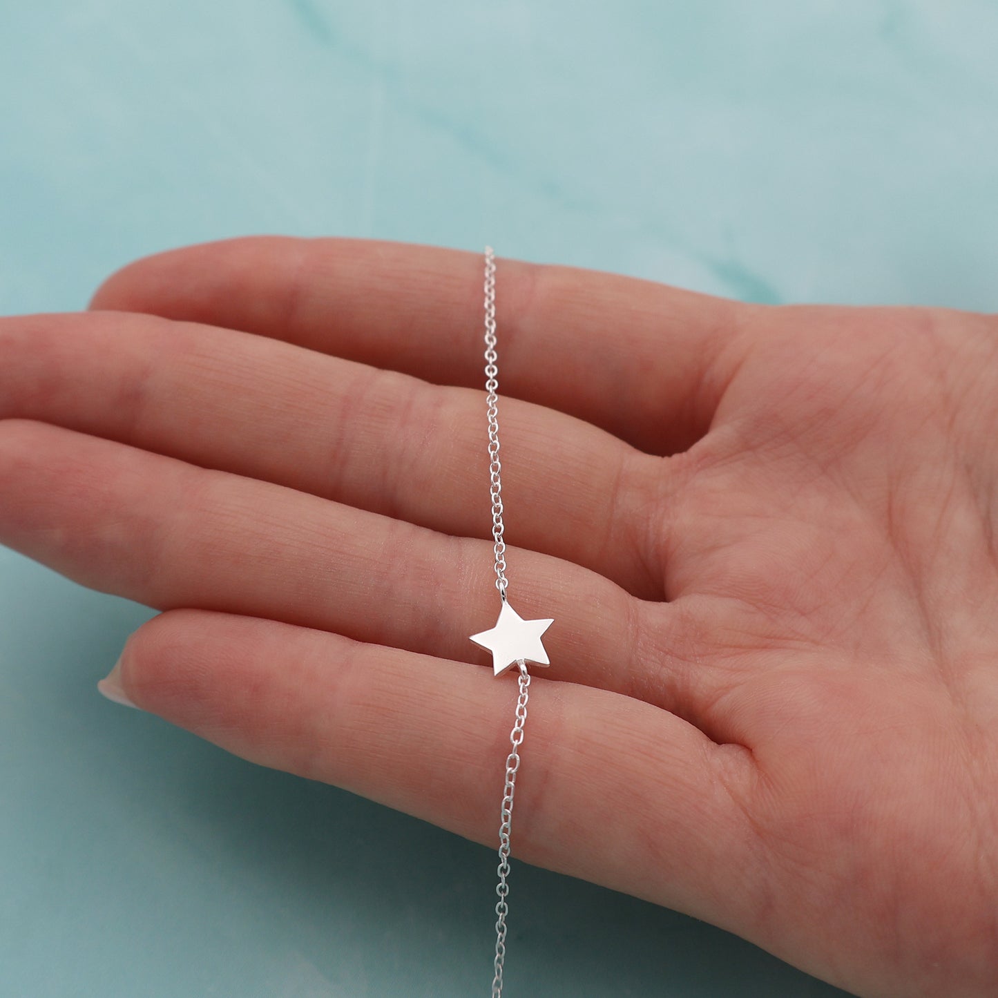 Bracelet with a fixed star pendant