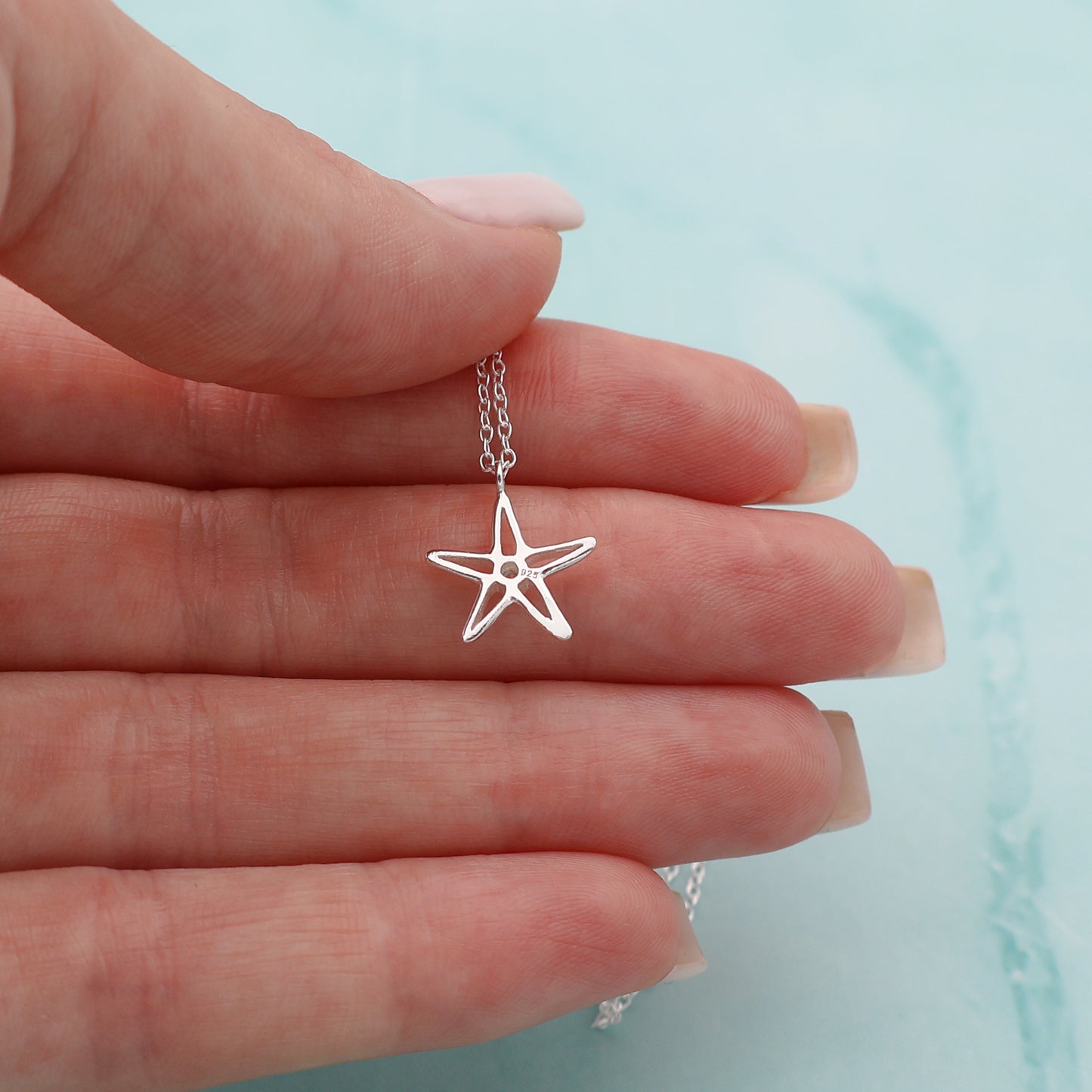 Necklace with a star pendant and a zirconia stone in the center