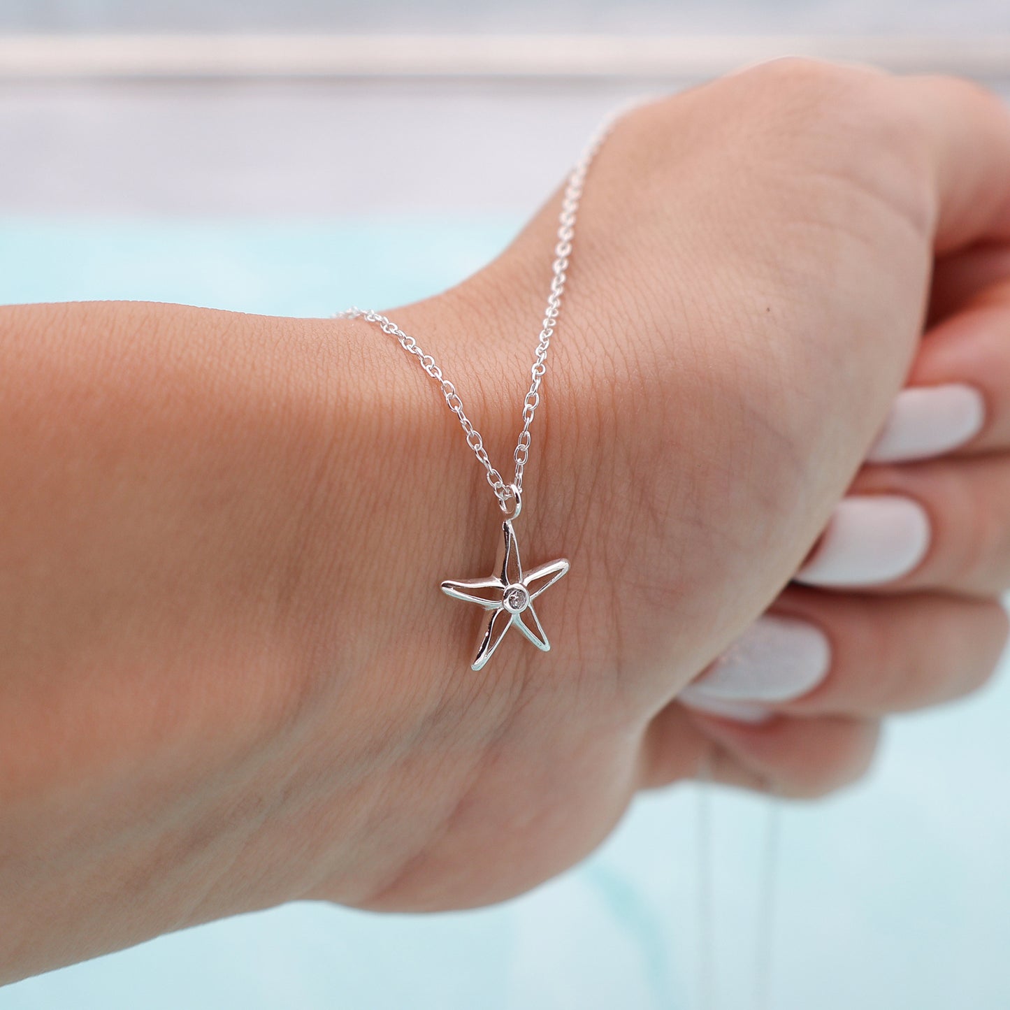 Necklace with a star pendant and a zirconia stone in the center