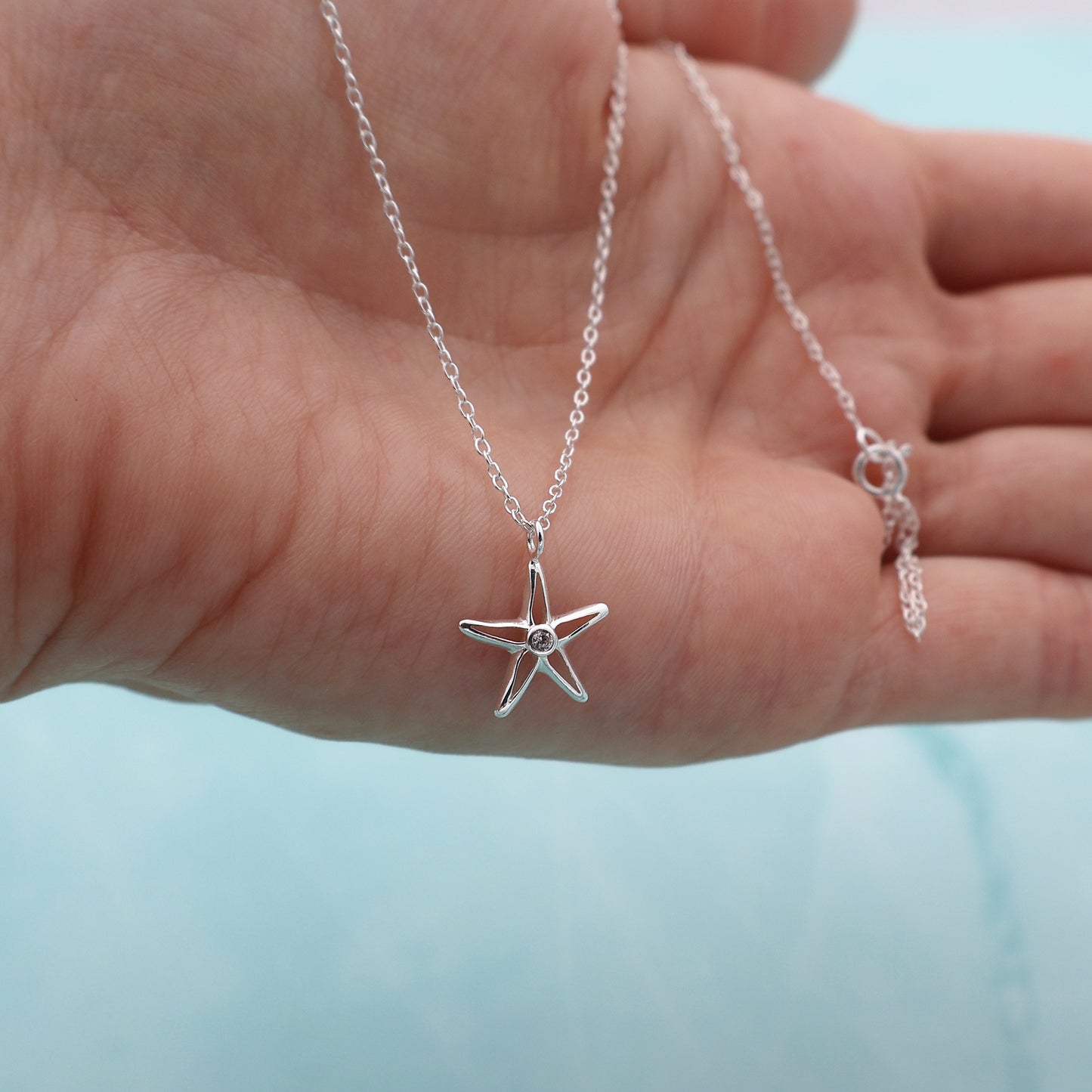 Necklace with a star pendant and a zirconia stone in the center