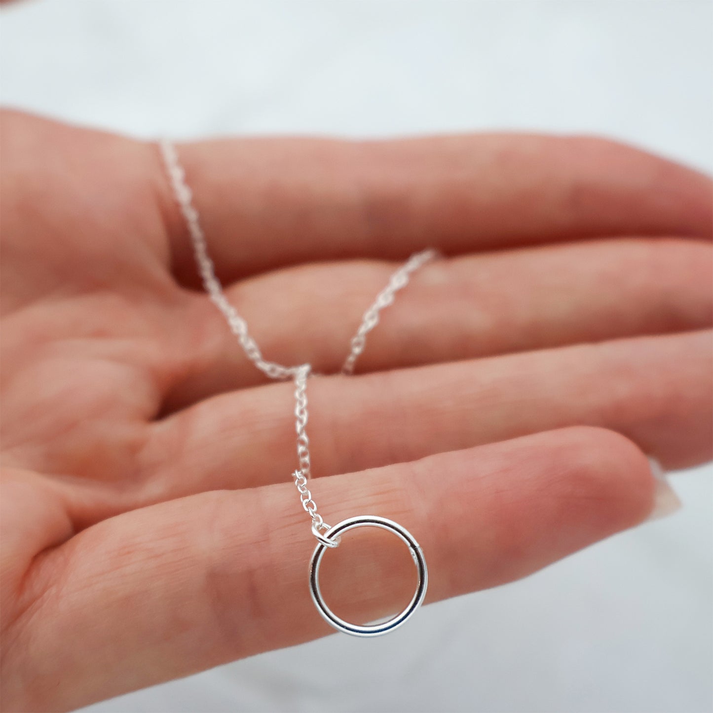 Necklace with an extender and a circle pendant