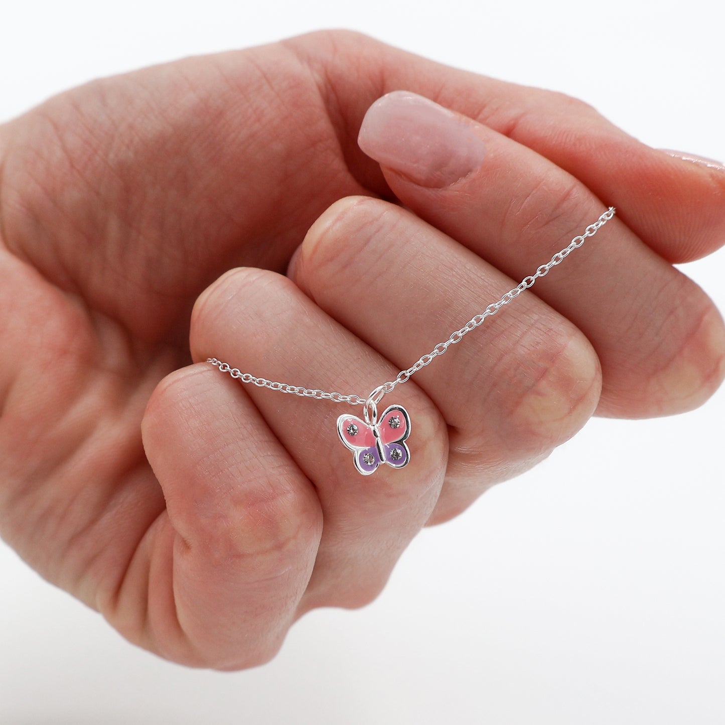 Bracelet featuring a pink and purple butterfly with 4 white crystals